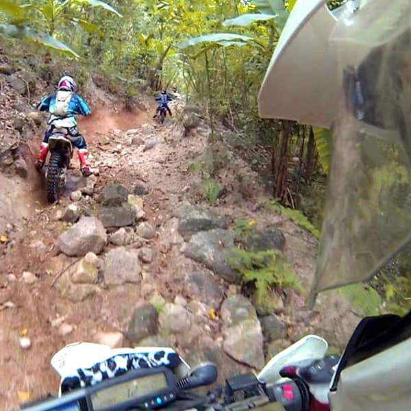Riders on a rocky jungle trail in Thailand